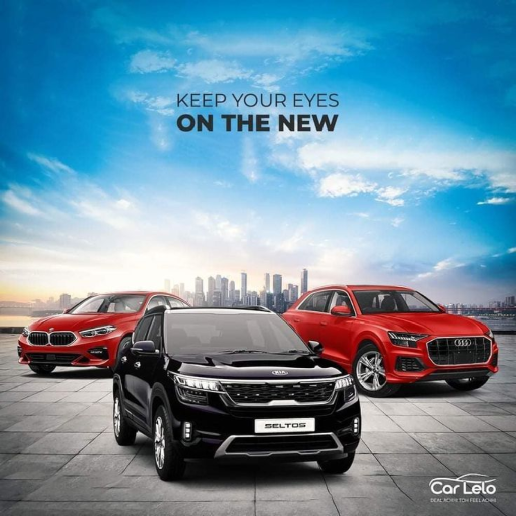Car showroom style banner featuring Kia Seltos in the center with Audi Q8 and BMW 2 Series Gran Coupe in the background, promoting new premium car models against a modern city skyline.